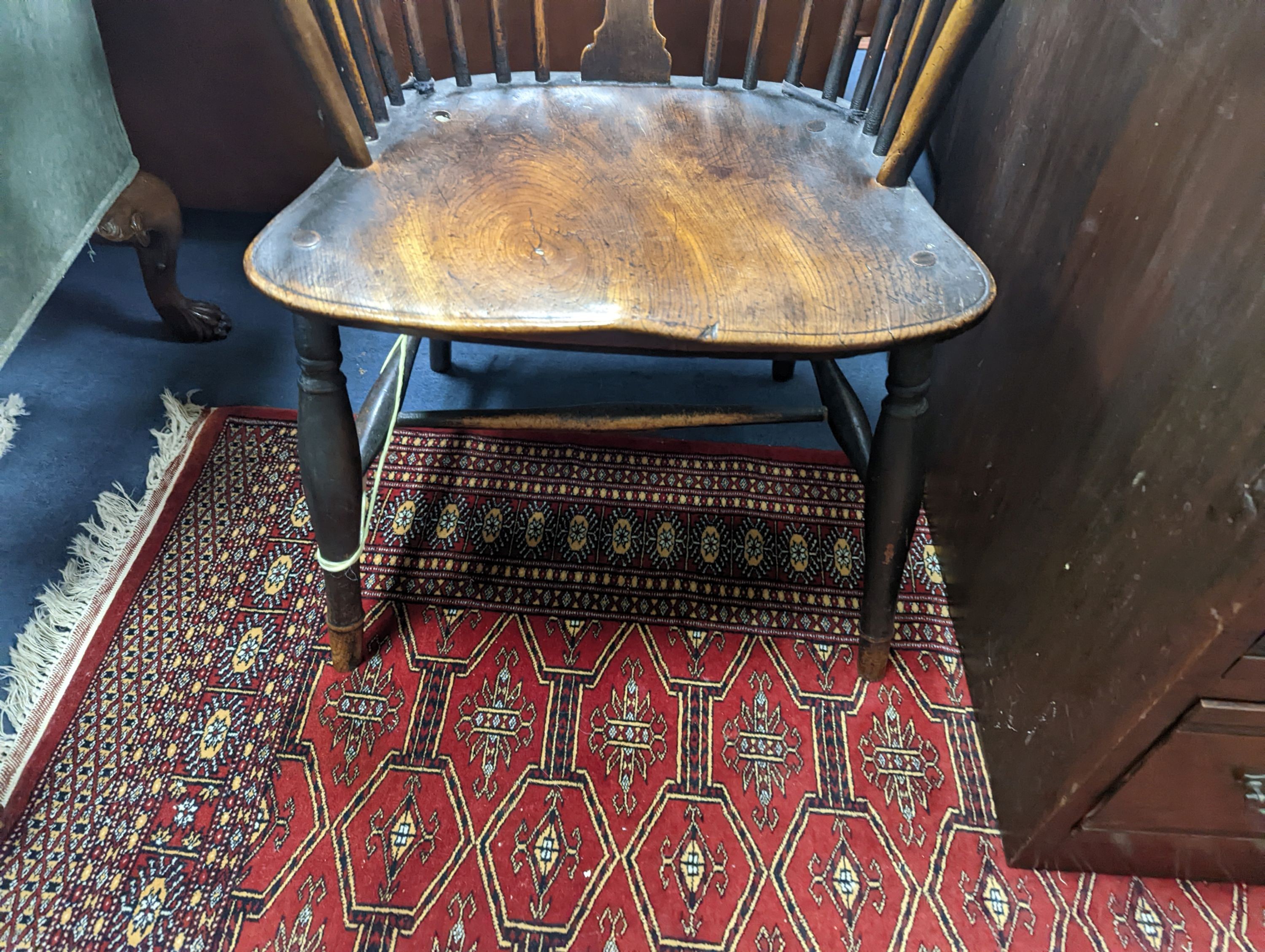 A 19th century elm and beech Windsor wheelback armchair, one leg a replacement, width 51cm, depth 41cm, height 101cm